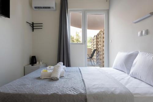 Postel nebo postele na pokoji v ubytování Liberal Mini Rooms & Suites