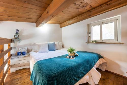 Ένα ή περισσότερα κρεβάτια σε δωμάτιο στο Villa Claudia - Calasetta