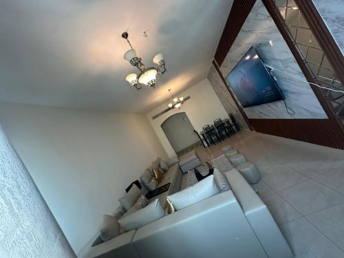 an overhead view of a living room with a couch at Spacious 3BR PLUS MAID ROOM in Sharjah