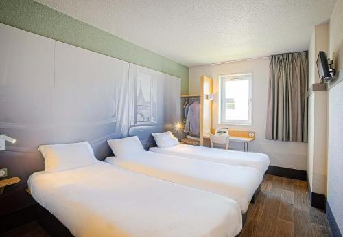 Postel nebo postele na pokoji v ubytování B&B HOTEL Mulhouse Ile Napoléon