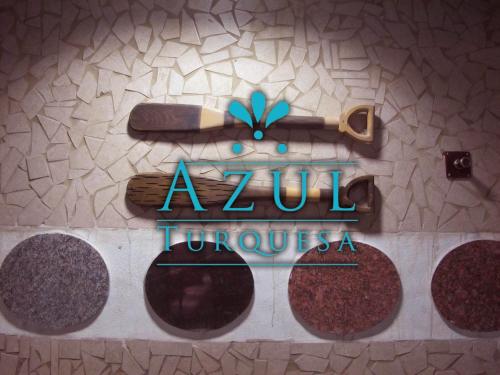 a sign for auzu tuojutska on a wall at Azul Turquesa in Cuernavaca