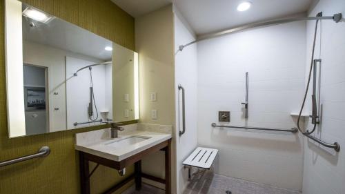 a bathroom with a sink and a mirror at Best Western Plus Gardena-Los Angeles Inn & Suites in Gardena