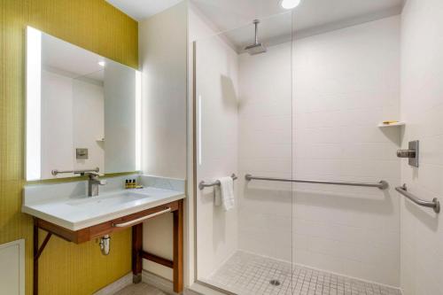 a bathroom with a sink and a shower at Best Western Plus Gardena-Los Angeles Inn & Suites in Gardena