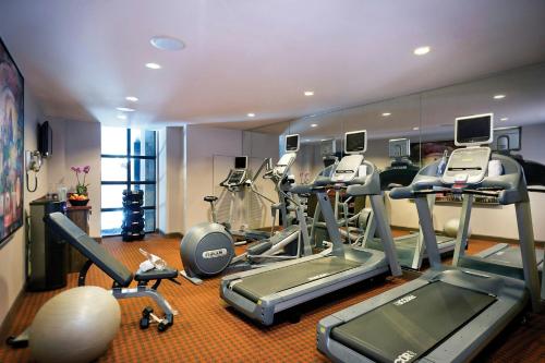a gym with a bunch of treadmills and machines at The Bohemian Hotel Savannah Riverfront, Autograph Collection in Savannah