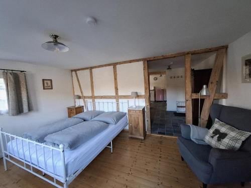 a bedroom with a bed and a couch at Stachelburg in Monschau