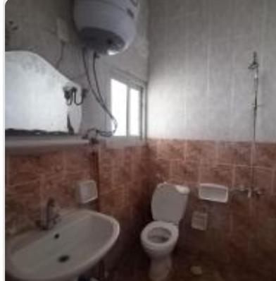 a bathroom with a toilet and a sink at Ageeba Beach Challet 17 in Marsa Matruh