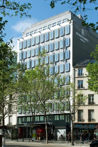 a building with a sign on the side of it at Renaissance Paris Republique Hotel & Spa in Paris