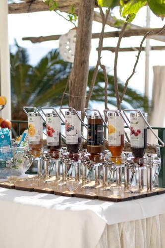 a tray of glasses of wine on a table at Hotel Aurora in Amalfi