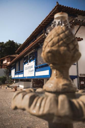 a statue in front of a building at Colonna Galapagos Garden Hotel in Búzios