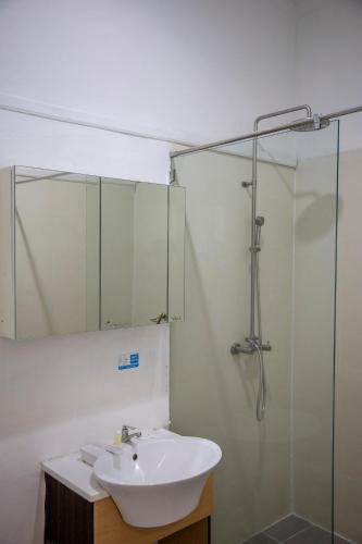 a bathroom with a sink and a shower at GP House Express Sukhumvit 81 in Bangkok