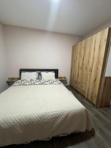 Postel nebo postele na pokoji v ubytování Apartman KVINS