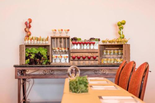a table in a restaurant with a buffet of food at The Battle House Renaissance Mobile Hotel & Spa in Mobile