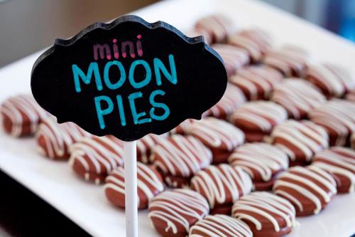 a display of mini moon pies with chocolate covered donuts at The Battle House Renaissance Mobile Hotel & Spa in Mobile
