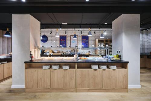 a kitchen with a counter with white shoes on it at Holiday Inn Express Lublin by IHG in Lublin
