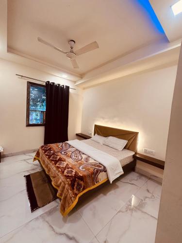 a bedroom with a bed in a room at Taj Castle A Boutique Homestay in Agra