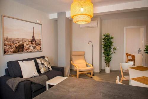 a living room with a couch and a table at Apartment Dolmen de Menga in Antequera