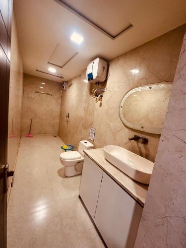 a bathroom with a toilet and a sink at Taj Castle A Boutique Homestay in Agra