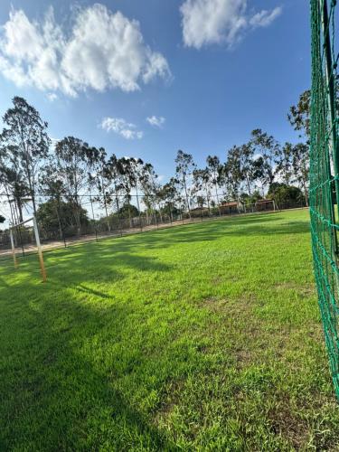 a soccer field with a net in the grass at Casa Verde Jade in Areia