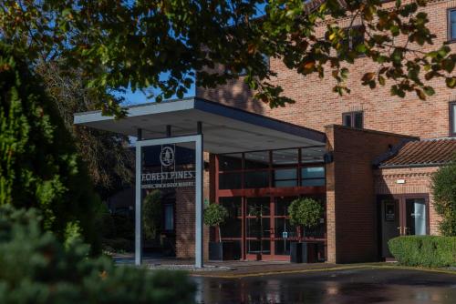 a building with a sign in front of it at Forest Pines Hotel, Spa & Golf Resort in Scunthorpe
