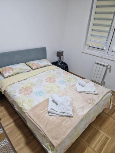 Ένα ή περισσότερα κρεβάτια σε δωμάτιο στο Apartman Mina