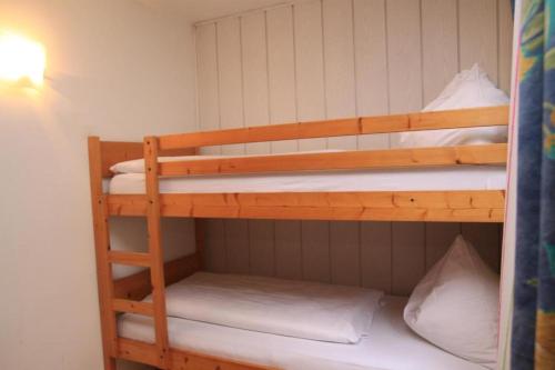 a couple of bunk beds in a room at Appartements Reiterhaus in Wagrain
