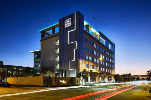 a building with a sign on it on a street at AC Hotel by Marriott Los Angeles South Bay in Los Angeles