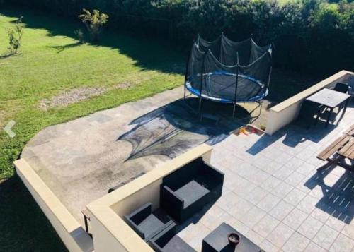 an overhead view of a basketball hoop on a patio at Villa 320m2 a 1h30 de Paris in Montcresson
