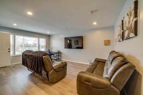 a living room with two chairs and a couch at 4 Mi to Lake Michigan East Chicago Home with Grill in East Chicago