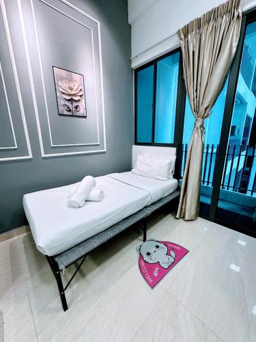 Ένα ή περισσότερα κρεβάτια σε δωμάτιο στο THE LUXE INFINITUM KLCC By KL MALAYSIA