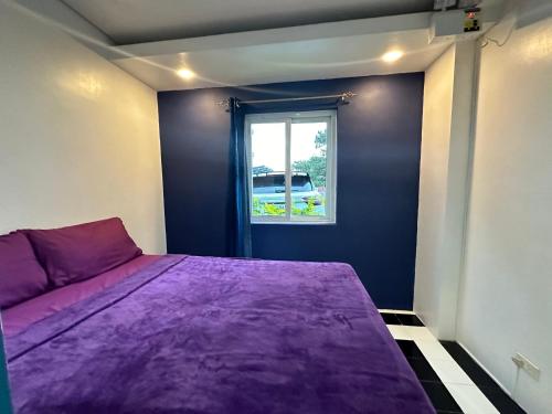 Ένα ή περισσότερα κρεβάτια σε δωμάτιο στο Baguio Equinoxx Homestay