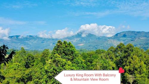 a sign that reads luxury living room with balcony and mountain view room at The Rock Face in Ella