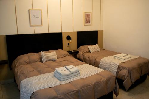 Postel nebo postele na pokoji v ubytování Hotel del Tren