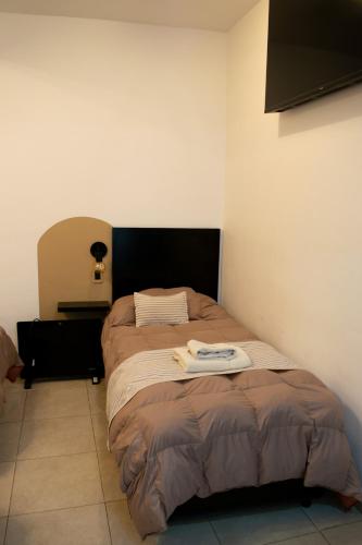 Postel nebo postele na pokoji v ubytování Hotel del Tren
