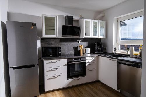 Kuchyň nebo kuchyňský kout v ubytování Apartment 1
