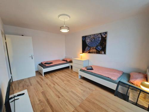 Ліжко або ліжка в номері Hafenblick Apartment - Central