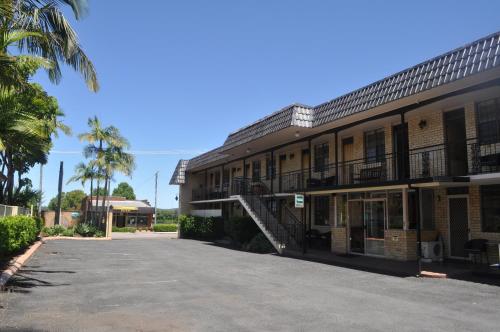 a building with a parking lot in front of it at In Town Motor Inn in Taree