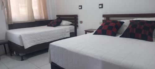 Katil atau katil-katil dalam bilik di Casa Josefa Hotel