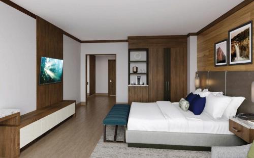 a bedroom with a large white bed in a room at Snoqualmie Casino & Hotel in Snoqualmie