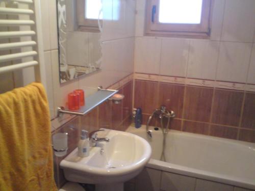 a bathroom with a sink and a toilet and a tub at Endzi in Travnik