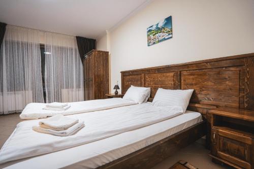 Postel nebo postele na pokoji v ubytování Hotel Rabbit Bran