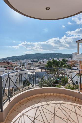 a balcony with a view of a city at ATHENS VILLA KROPIA #AthensAirport #AirView #Sunrise in Koropíon