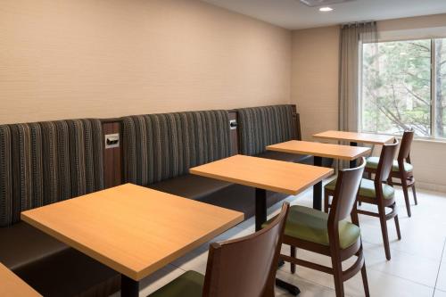 a row of tables and chairs in a restaurant at Fairfield Inn by Marriott Loveland Fort Collins in Loveland
