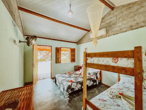 Postel nebo postele na pokoji v ubytování Guedes Residence