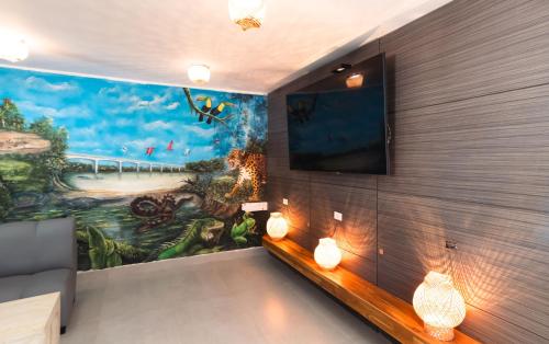 TV a/nebo společenská místnost v ubytování Hotel El Aeropuerto