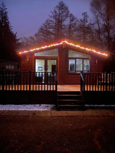 a small house with lights on top of it at Lomond Lodge Rowardennnan in Rowardennan