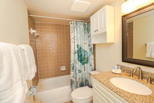 a bathroom with a sink and a toilet and a shower at Island South 36 in Saint Augustine