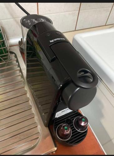 a black mixer sitting on top of a table at Λιέγη Orestiada apartment no 2 in Orestiada