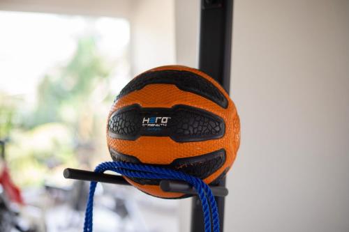 an orange ball on a pole with a blue rope at Bragha Apartments And Hotel in Takoradi