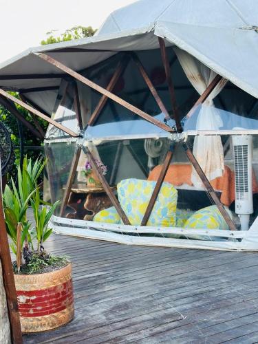 a tent sitting on top of a wooden deck at Eco-Glamping Shalom in Mariquita