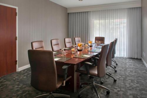 a conference room with a long table and chairs at Courtyard by Marriott Basking Ridge in Basking Ridge
